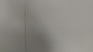 A plain wall with two vertical streaks of a brownish substance. - Cosy Facebook Headquarters. I own them cause I said I did. Please refer to me TR (Fairhaven)