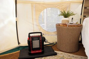 A tent with a circular window, a portable heater, a wicker basket, and a potted plant. - ★Escape & Relax ~ Breathtaking Creekside Getaway with Outdoor Tub★ (Georgetown)