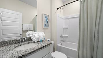 Executive House, 4 Bedrooms, Patio | Bathroom | Separate tub and shower, free toiletries, towels, soap