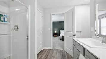 Shower, hair dryer, towels, shampoo