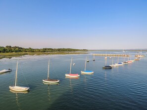 A marina with multiple sailboats docked. - 4 Copse Lane (Freshwater)