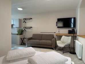 Estudio Deluxe | Área de sala de estar