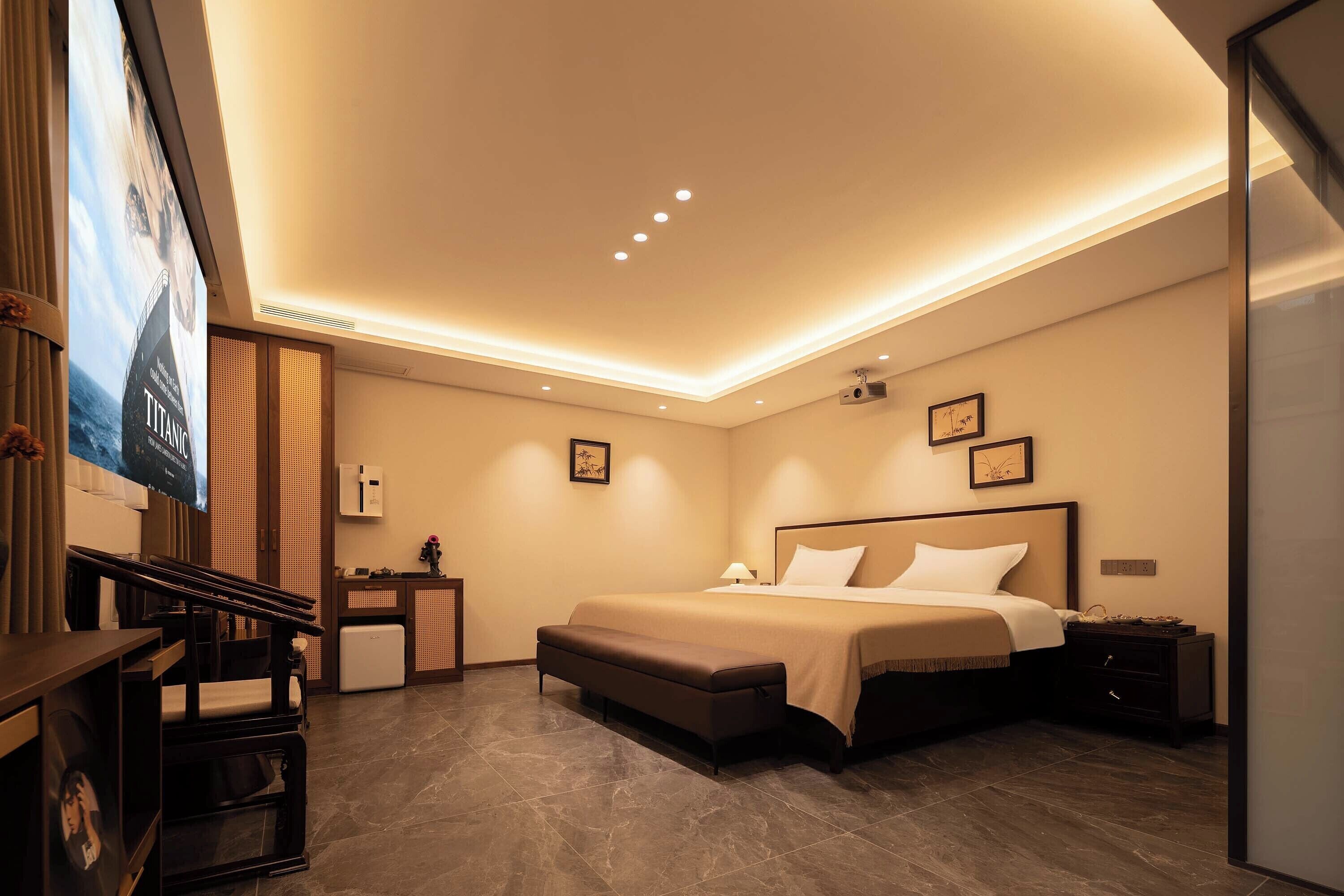 Quarto casal premier, vista para o jardim | Área de estar