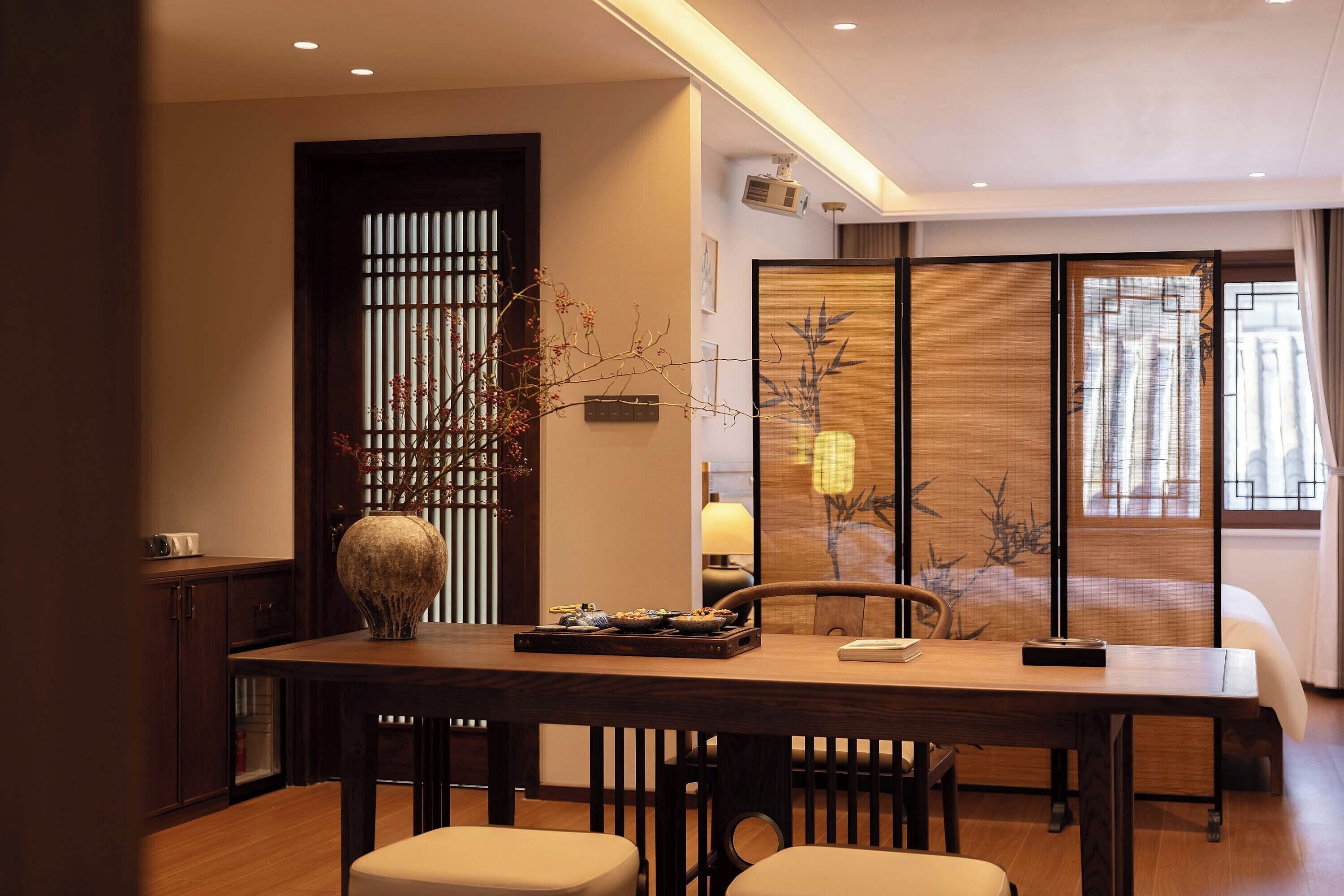 Luxury Suite, Garden View | Minibar, desk, laptop workspace, blackout drapes