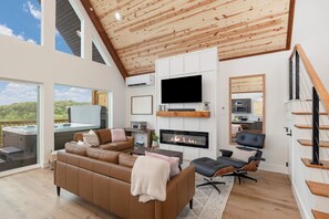 TV, fireplace, books, music library - Modern A-Frame + Hot Tub with Lake Views Near Branson (MARVEL CAV PK)