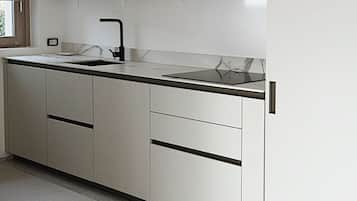Fridge, stovetop, dishwasher, coffee/tea maker