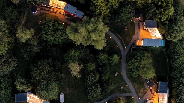 An aerial view of a residential area with multiple houses connected by pathways, surrounded by dense trees. - Sleeps 2 - Hot Tub - Pet Friendly - Peggysue (Skegness)