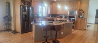 Oversized three car garage, huge barn,
 beautiful pond, grill on upper deck.
