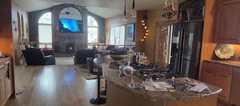 Oversized three car garage, huge barn,
beautiful pond, grill on upper deck.