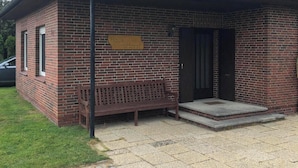 A small brick building with a sign reading 'Hays Horst.' - Bungalow close to the beach in Schillig with garden, three bedrooms, two bathrooms, up to three parking spaces and dog-friendly facilities - ideal for families and friends. (Schillig)