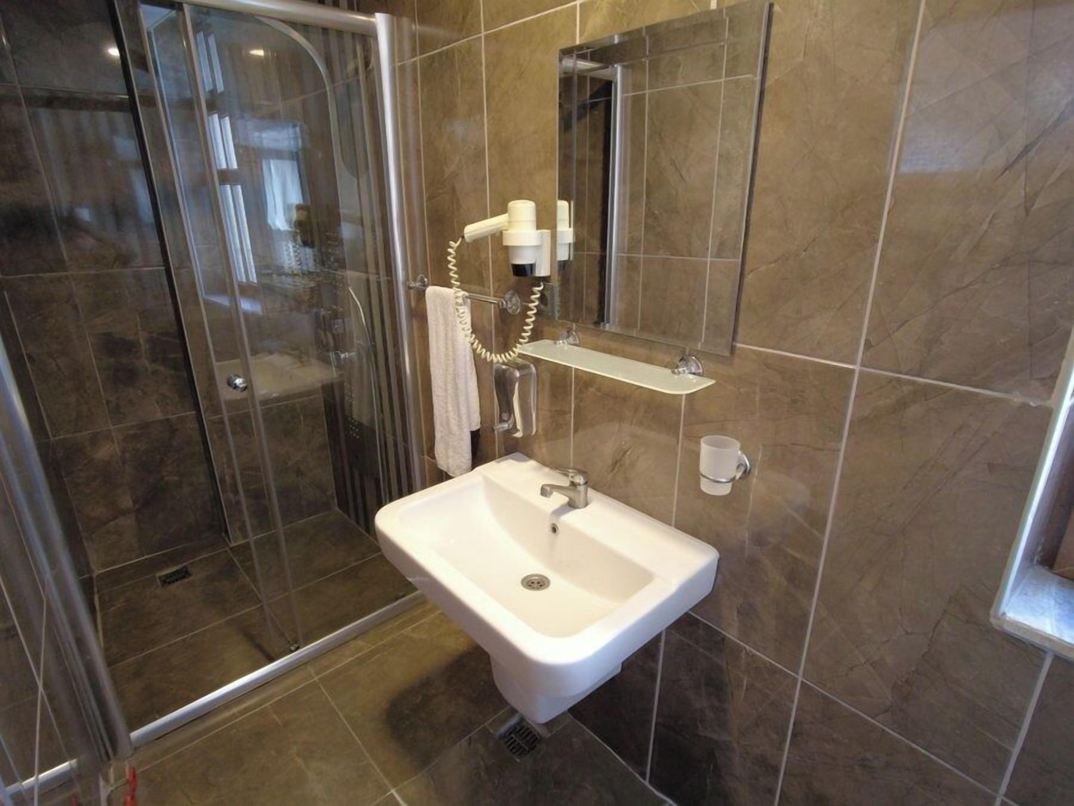 Shower, hair dryer, slippers, towels