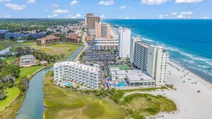 A coastal hotel with multiple buildings, a beach, and a river. - Shore Drive 2 bedroom sleeps 4 Myrtle Beach (Myrtle Beach)
