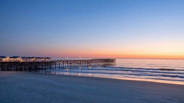 A pier extending into calm waters with a clear sky above. - Ocean View Oasis in Pacific Beach 2BR 2BA Balcony Pool  Monthly Stay (San Diego)