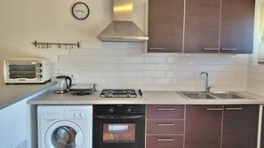 Fridge, stovetop, toaster, cookware/dishes/utensils - Podere 23 - Two Bedroom Apartment, Sleeps 5 (Alghero)