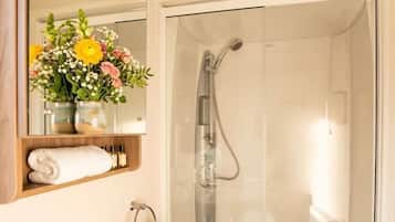 Shower, hair dryer, towels, shampoo