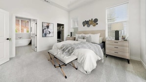 A bedroom with a bed, bedside table, nightstand, and a view of the bathroom. - Fabulous, brand new 3-bedrm house with views, high-speed internet, AC in Auburn. (Auburn)