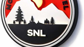 A circular logo with 'MOUNTAIN VIEW HOTEL' and 'SNL' text, a mountain silhouette, and trees. - SNL Mountain View Hotel (Akosombo)
