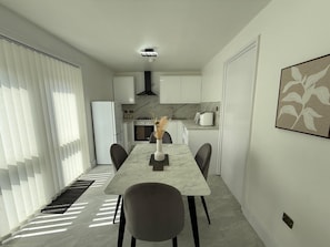 A modern kitchen with white cabinets, a marble countertop, and a dining area with a marble table and chairs. - “Large Newcastle Home for 8– 4 guest Bedrooms, 5 Beds (Newcastle upon Tyne)