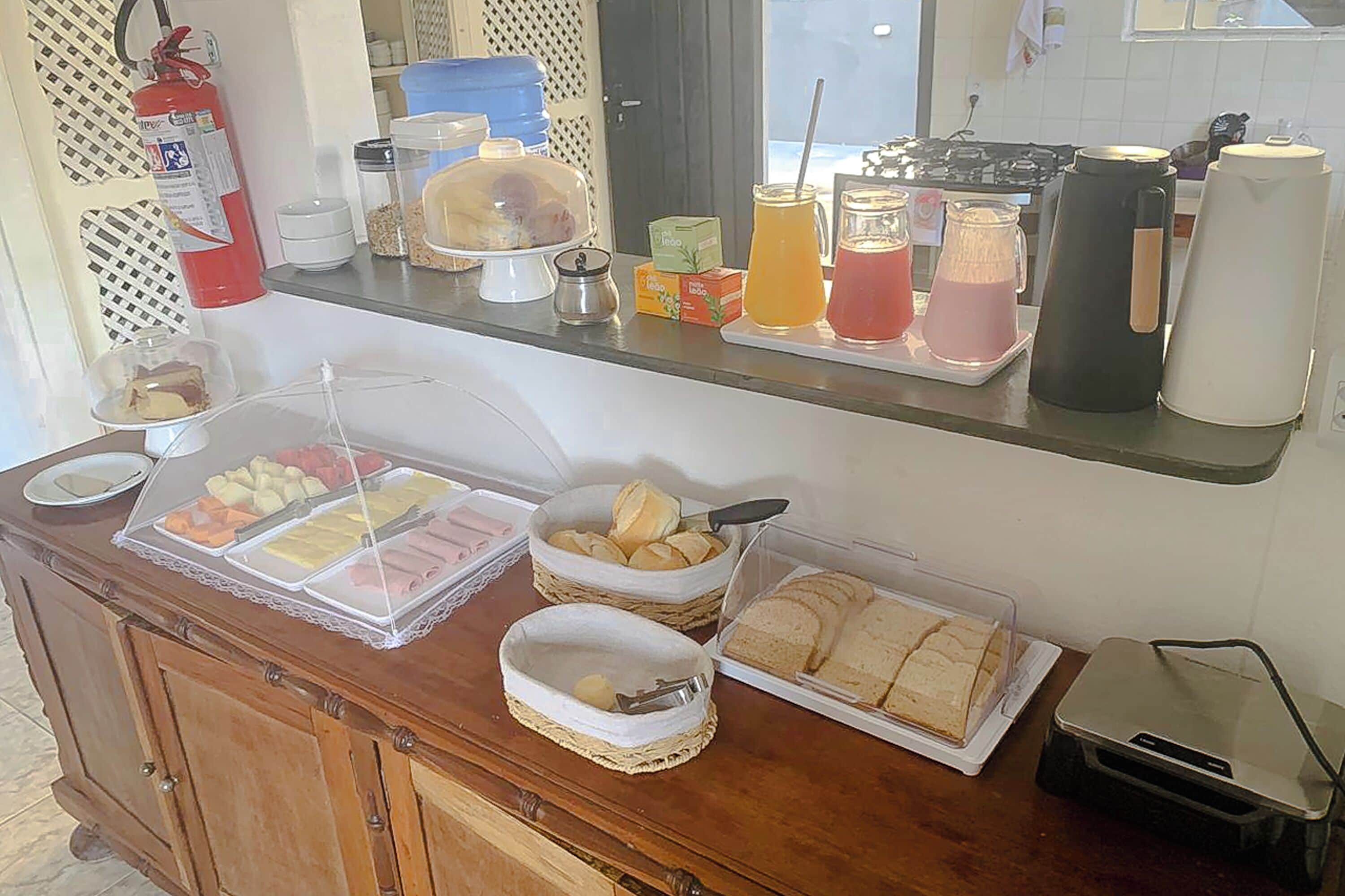 A breakfast buffet with various food items and beverages.