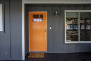A front door with a glass panel and a small window above it. - Forest & Vine - Hot tub and Pet Friendly! (Templeton)