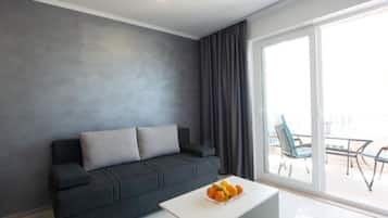 Apartment (Two Bedroom Apartment with Sea View a) | Living room | 32-inch flat-screen TV with cable channels