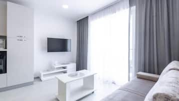 Apartment (Superior One Bedroom Apartment with S) | Living room | 32-inch flat-screen TV with cable channels