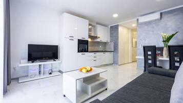 Apartment (Two Bedroom Apartment with Sea View a) | Living room | 32-inch flat-screen TV with cable channels