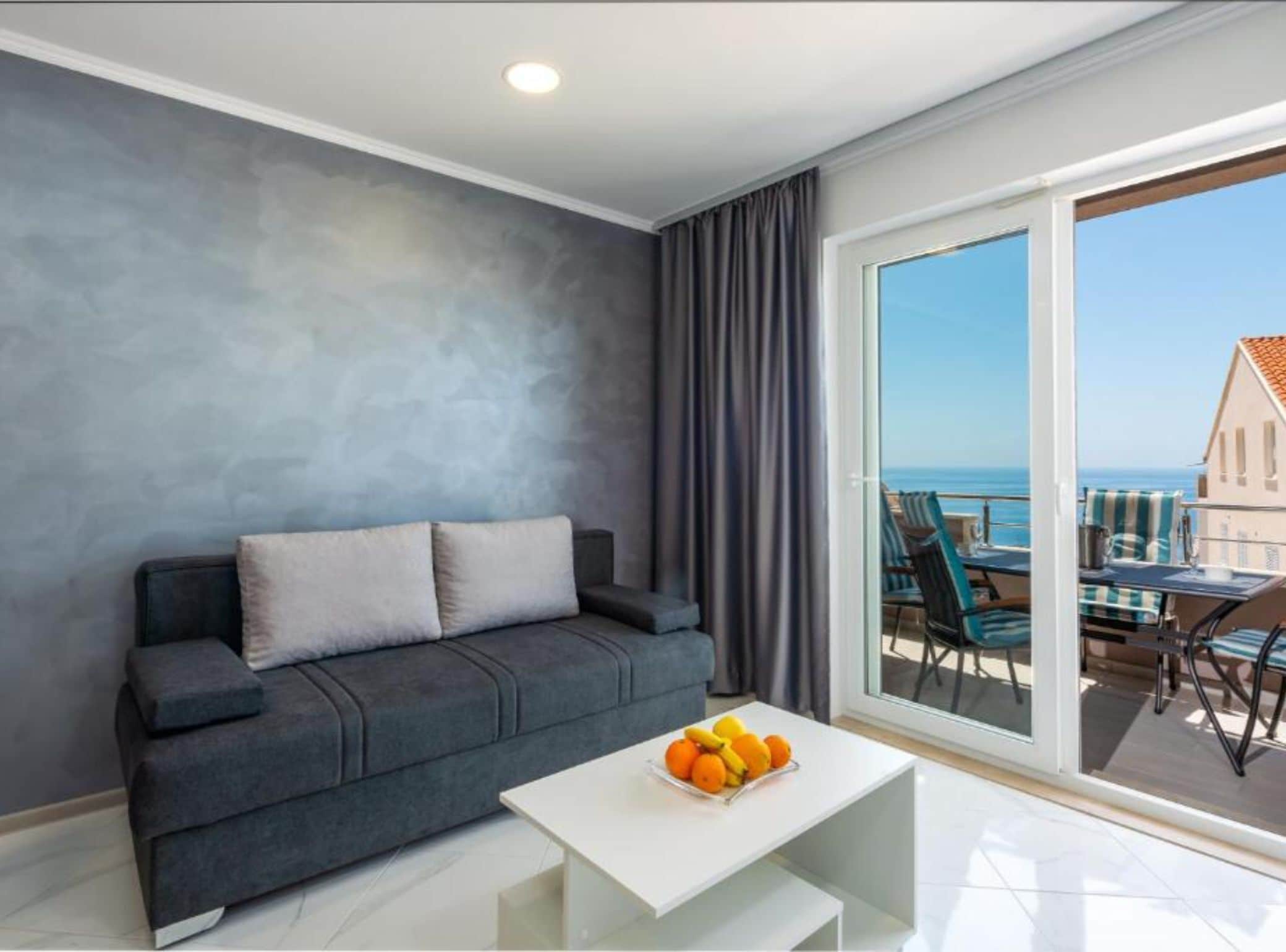 Apartment (Two Bedroom Apartment with Sea View a) | Living room | 32-inch flat-screen TV with cable channels