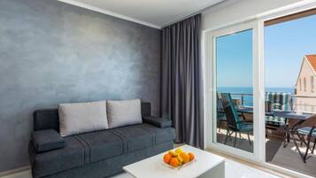 Apartment (Two Bedroom Apartment with Sea View a) | Living room | 32-inch flat-screen TV with cable channels