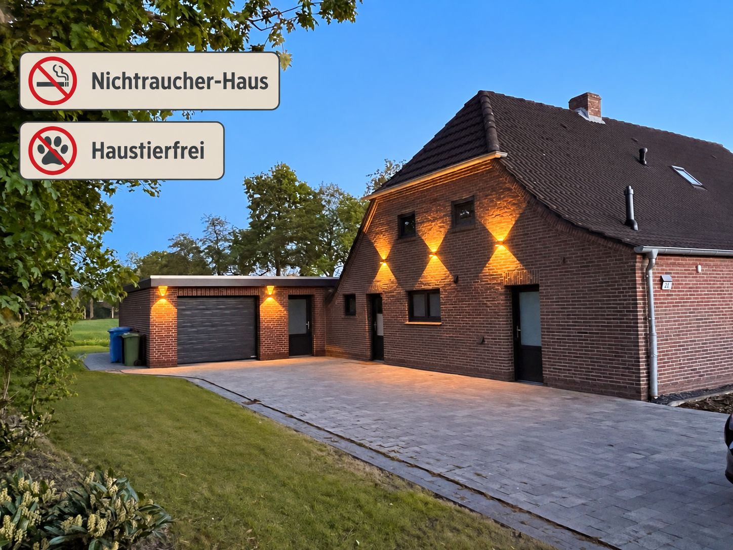 A brick building with a garage and a driveway.