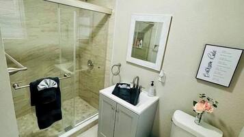 Shower, hair dryer, towels