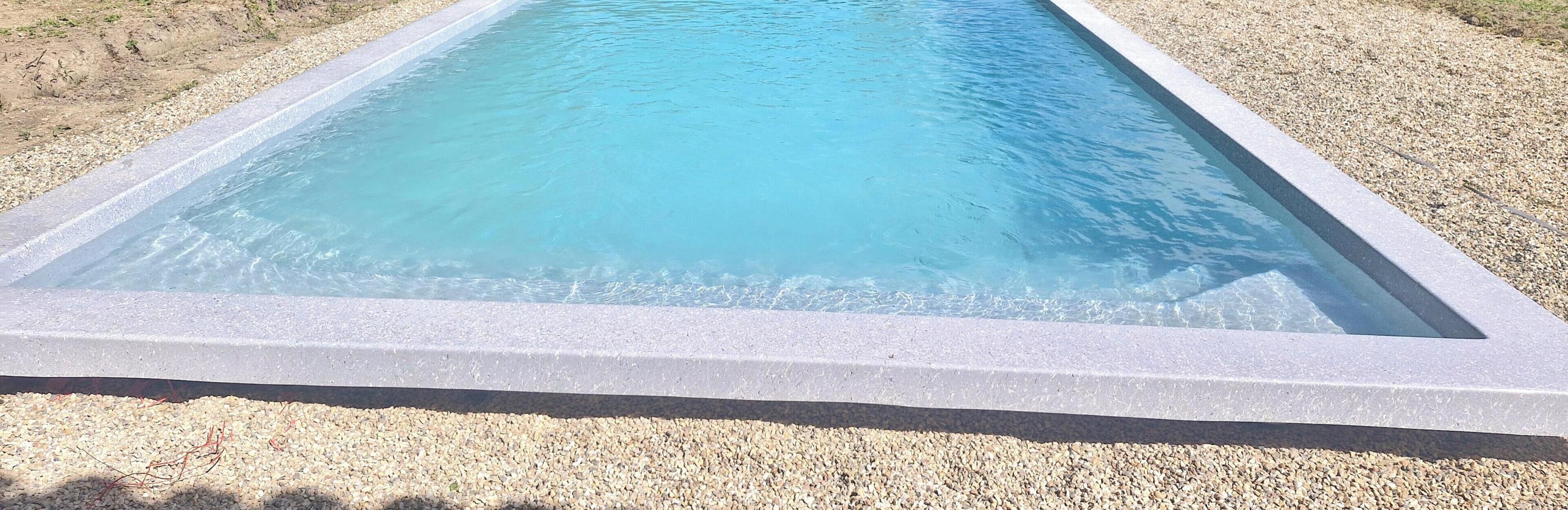 Seasonal outdoor pool, open 10:00 AM to 7:00 PM, pool umbrellas
