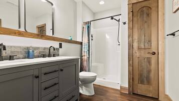 Shower, hair dryer, towels, shampoo