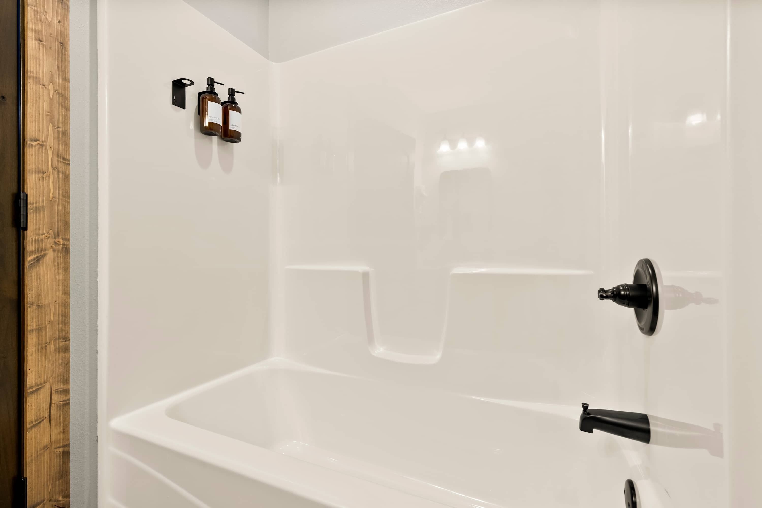 Shower, hair dryer, towels, shampoo