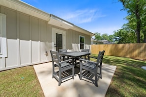 A house with a patio, a table, and chairs. - Marigold House: Foley (Foley)