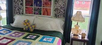Charming 2 bedroom bungalow with lovely outdoor space, sleeps 5 adults 2 kids