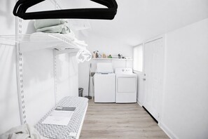 A compact, modern room with a bunk bed, a washing machine, and a dryer. -     Cozy Atlanta Stay Sleeps 4 Near ATL. Free Wifi + Self check in (College Park)