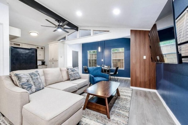 Deluxe House | Living area | 65-inch TV with digital channels, streaming services