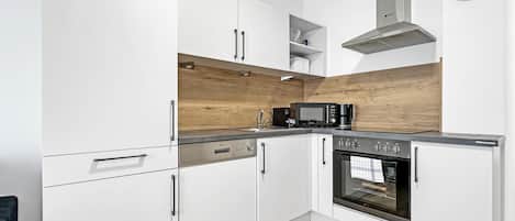 Deluxe Apartment, Balcony | Private kitchen | Espresso maker, electric kettle, dining tables