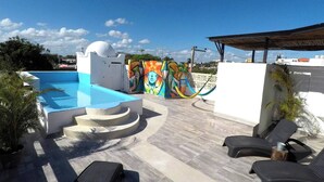 A rooftop pool with a white dome, a colorful mural, and a covered seating area. - Air, Clean, 1 BR, 2nd Floor, King Bed, V13 (Playa del Carmen - Valentina Suites)
