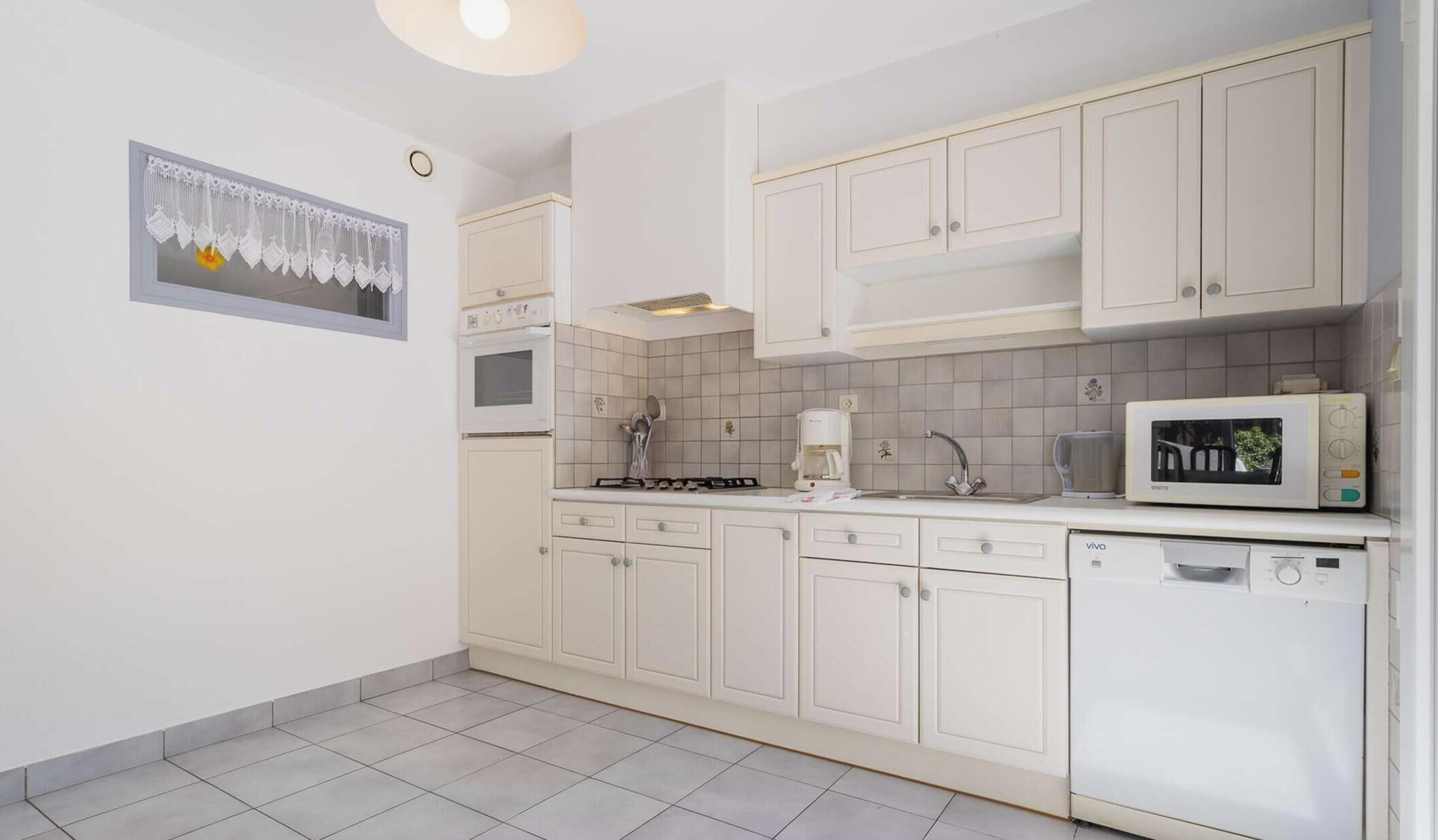 Fridge, microwave, toaster, cookware/dishes/utensils