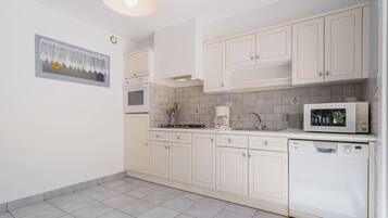 Fridge, microwave, toaster, cookware/dishes/utensils