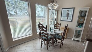 A dining area with a table, chairs, and a chandelier. - A cozy, family‑friendly 31TP (Gail)