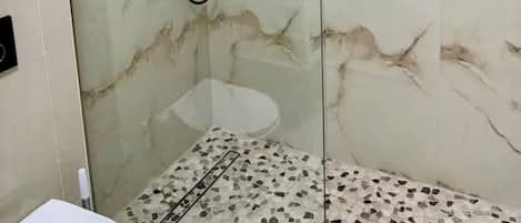 Shower, hair dryer, towels, soap