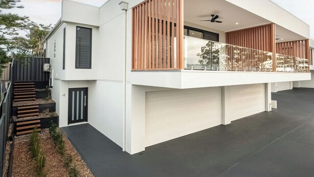 A modern two-story house with a balcony, a staircase, and a flat roof. - SAND -  Walk to Marina I Bay Views I 2 Master Suites (Nelson Bay)