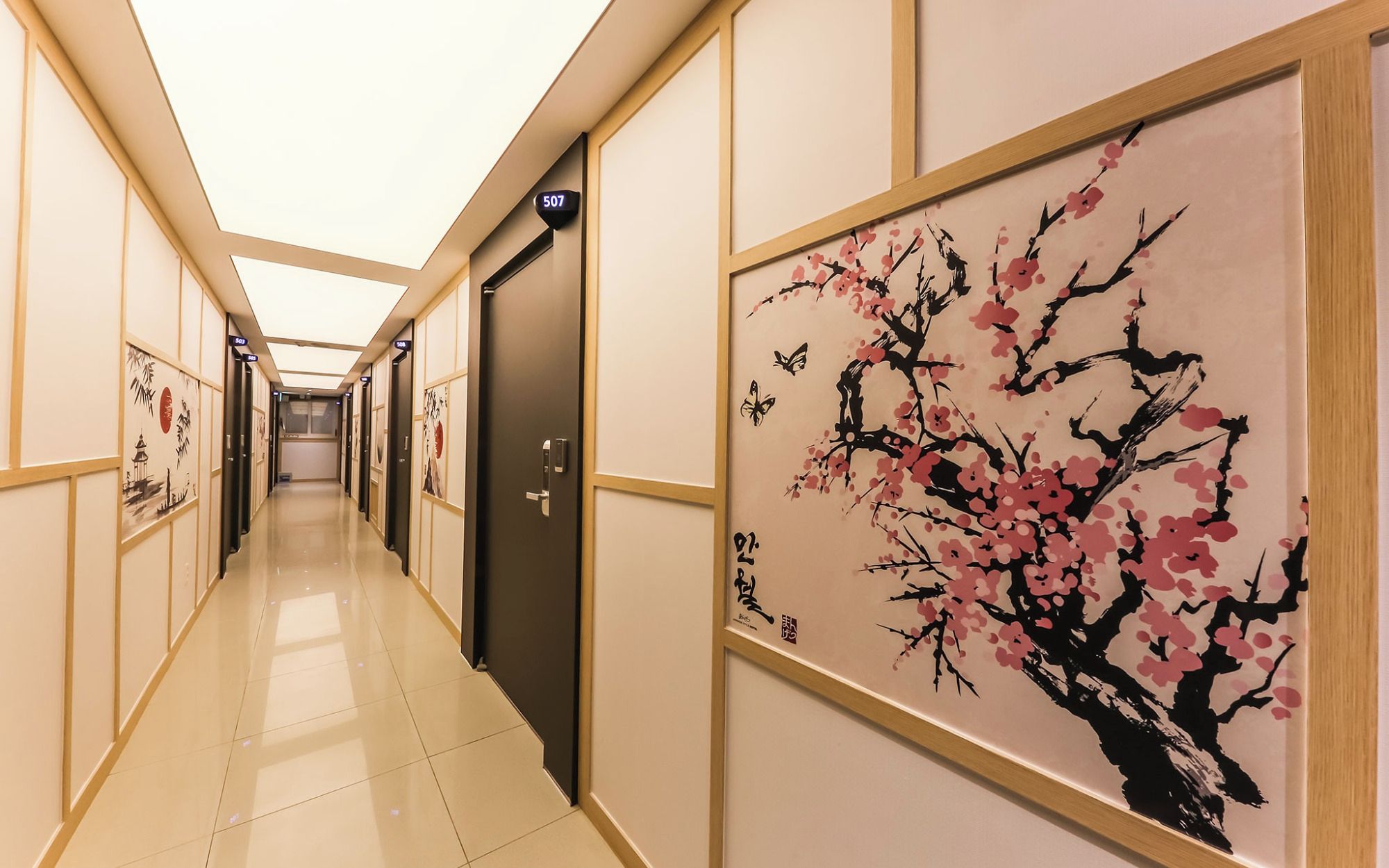 A hotel corridor with doors numbered 507 and 508, leading to rooms.