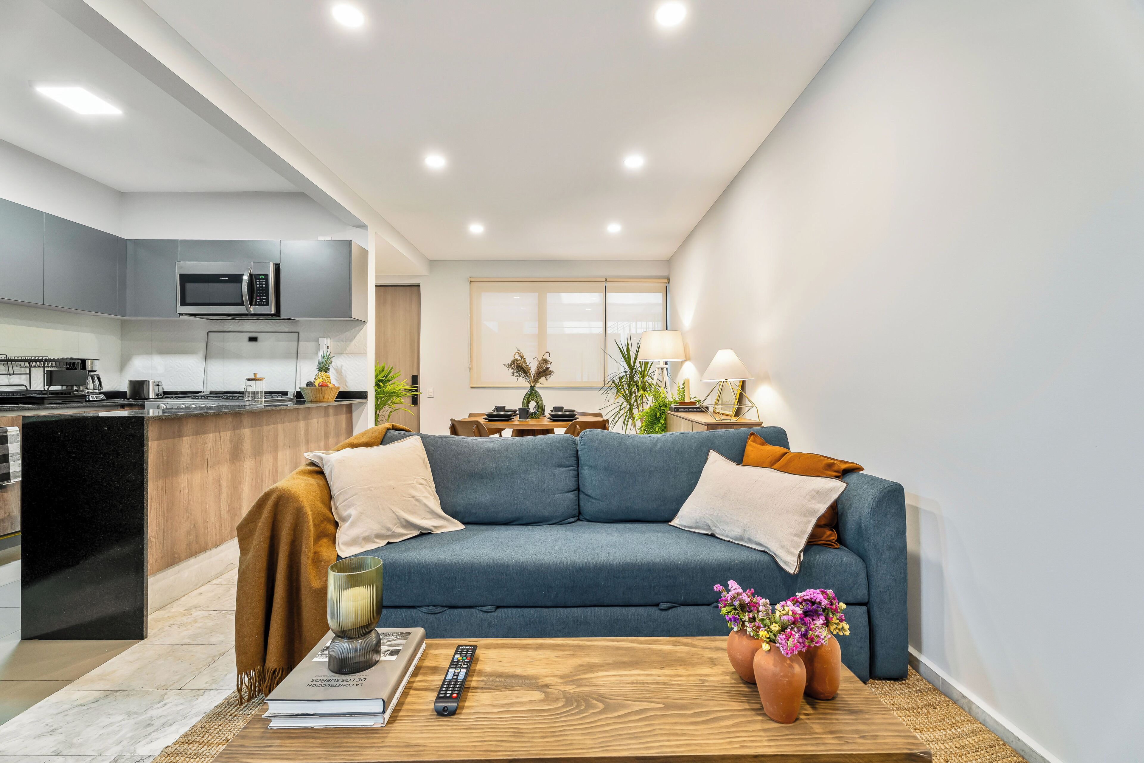 Departamento Deluxe, vista a la ciudad | Área de sala de estar
