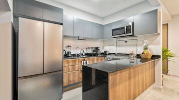 Departamento Deluxe, vista a la ciudad | Cocina privada