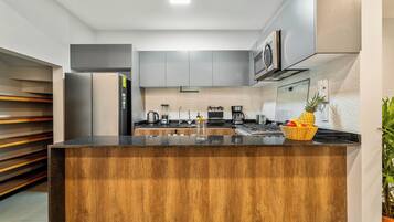 Departamento Deluxe, vista a la ciudad | Cocina privada