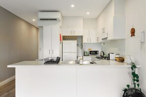 Fridge, microwave, oven, stovetop - KozuGuru | Glebe | Iconic Inner-City Retreat (Glebe)